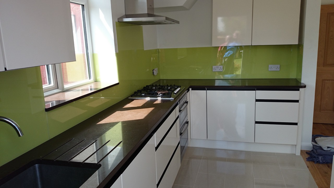 Lime green glass kitchen splashback installed by Greenford glaziers