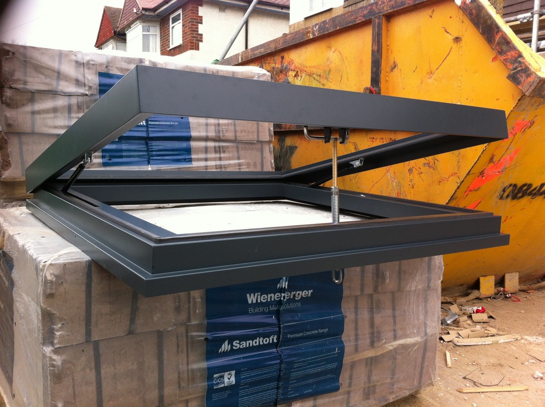 Opening flat roof skylight in anthracite grey installed in Greenford